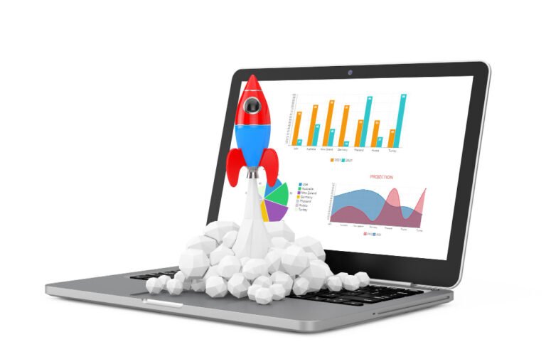 Rocket launching from a laptop with business growth charts on screen.